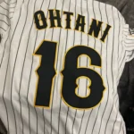 Custom Black and Gold Baseball Jersey photo review